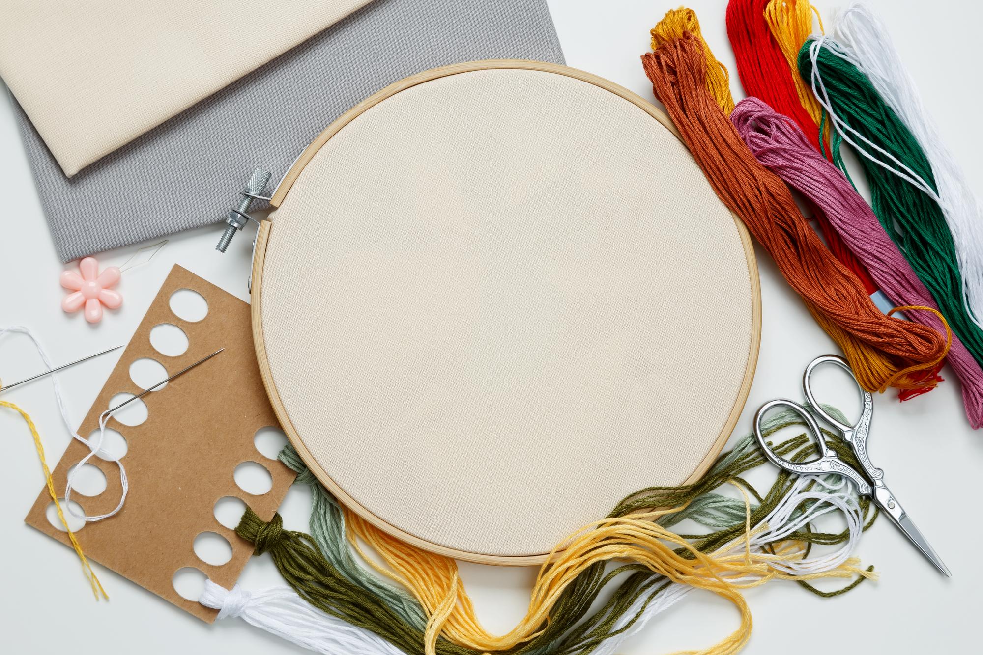 Studio workspace with threads and hoops